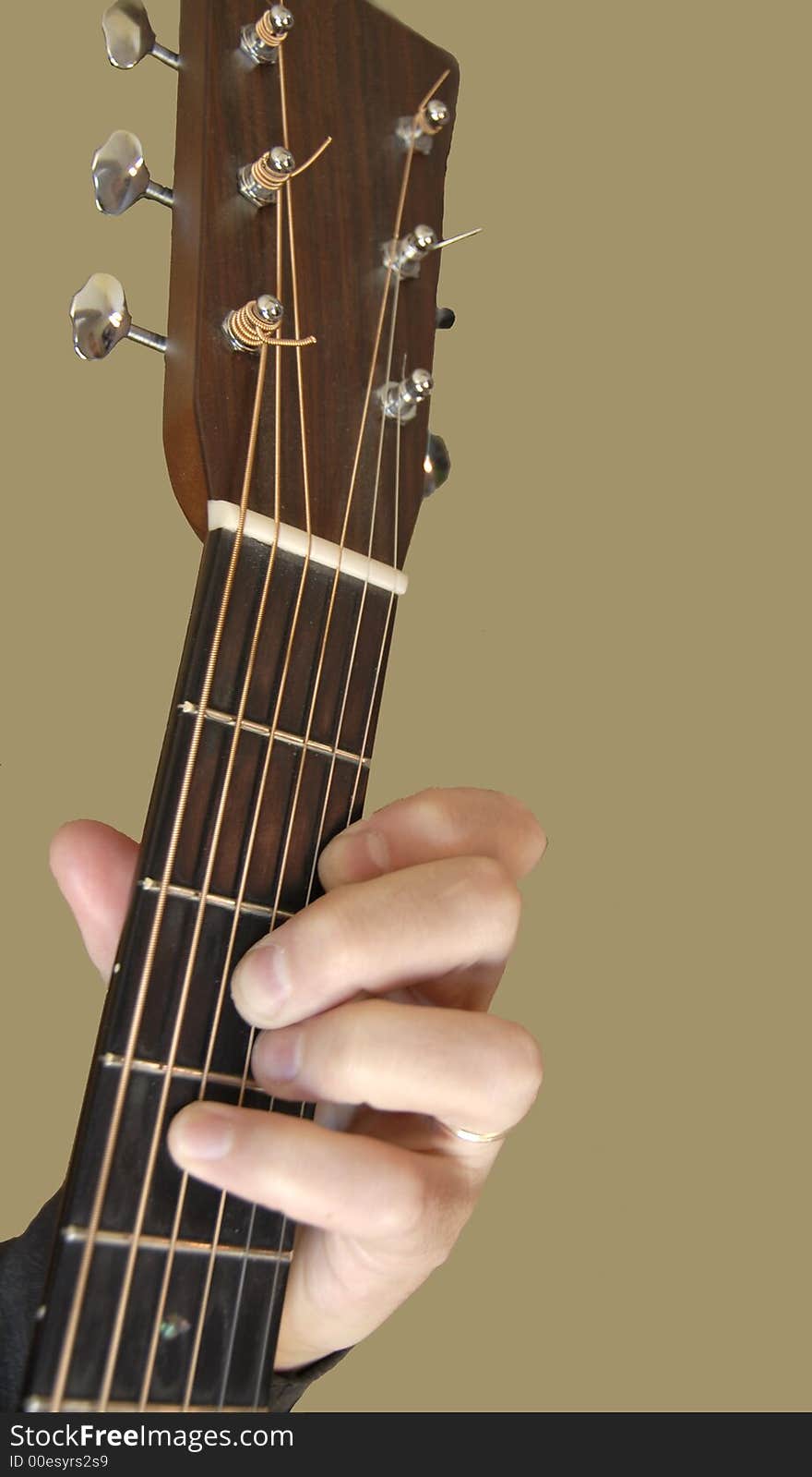 A closeup of a chord on the guitar. A closeup of a chord on the guitar