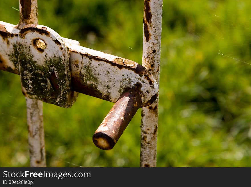 Old rusted castle gate fence lock. Old rusted castle gate fence lock