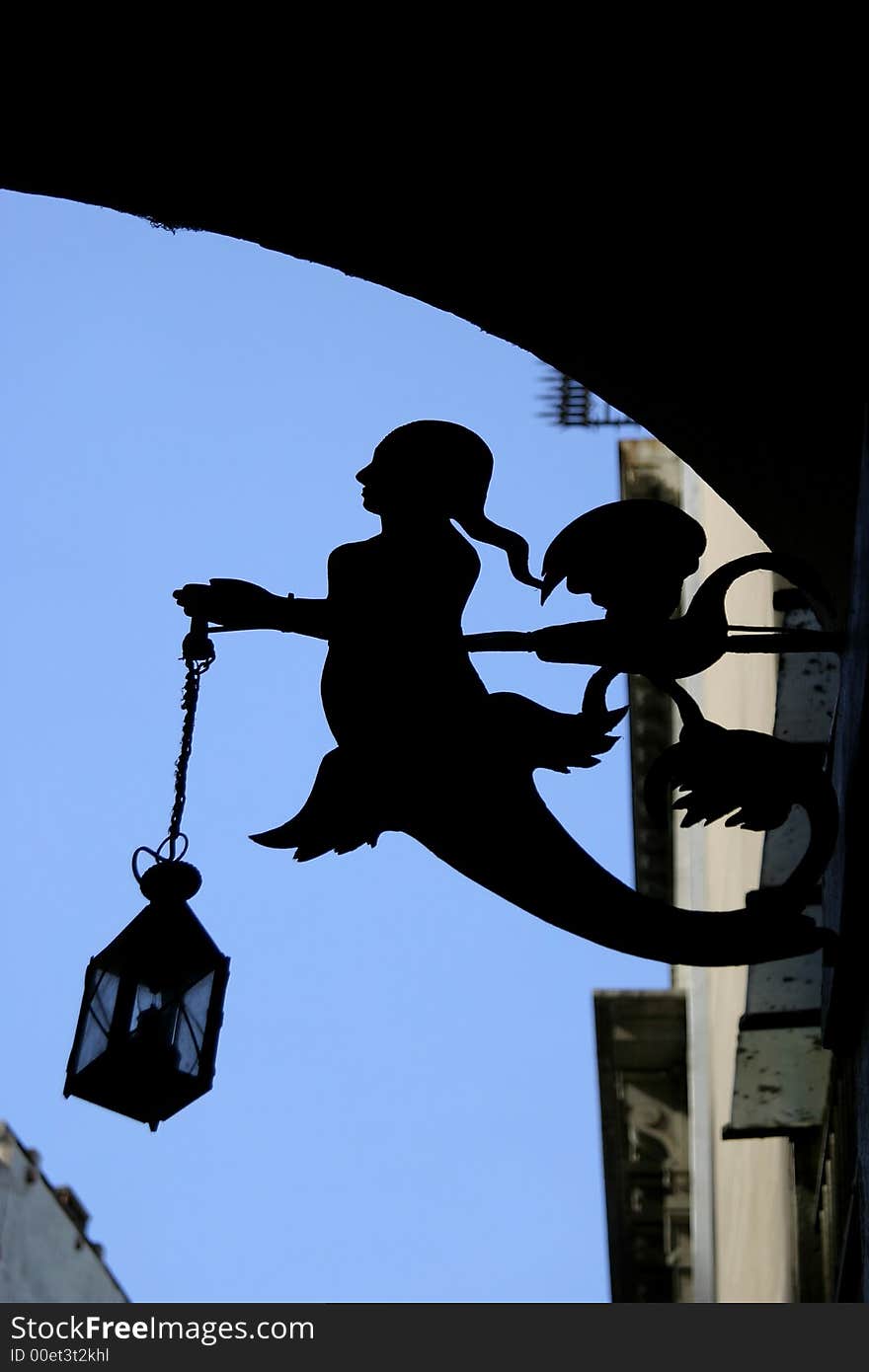 The silhouette of street lamp in form of mermaid. The silhouette of street lamp in form of mermaid