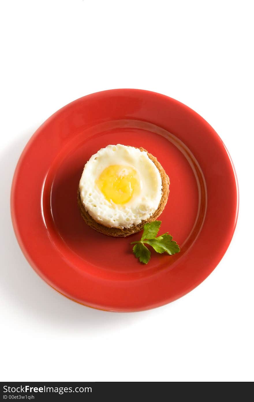 Fried egg on red dish