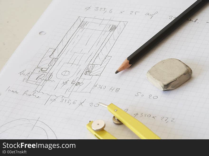 Engineering drawing on drawing desk with rubber and pencil