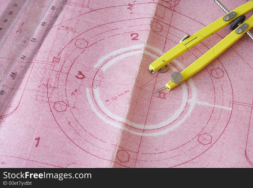 Pink engineering drawing on drawing desk with ruler. Pink engineering drawing on drawing desk with ruler