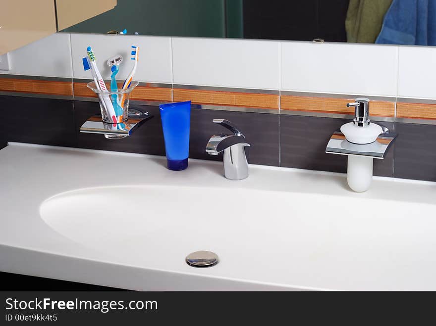 Interior of modern bathroom with sink, tap and accessories. Interior of modern bathroom with sink, tap and accessories