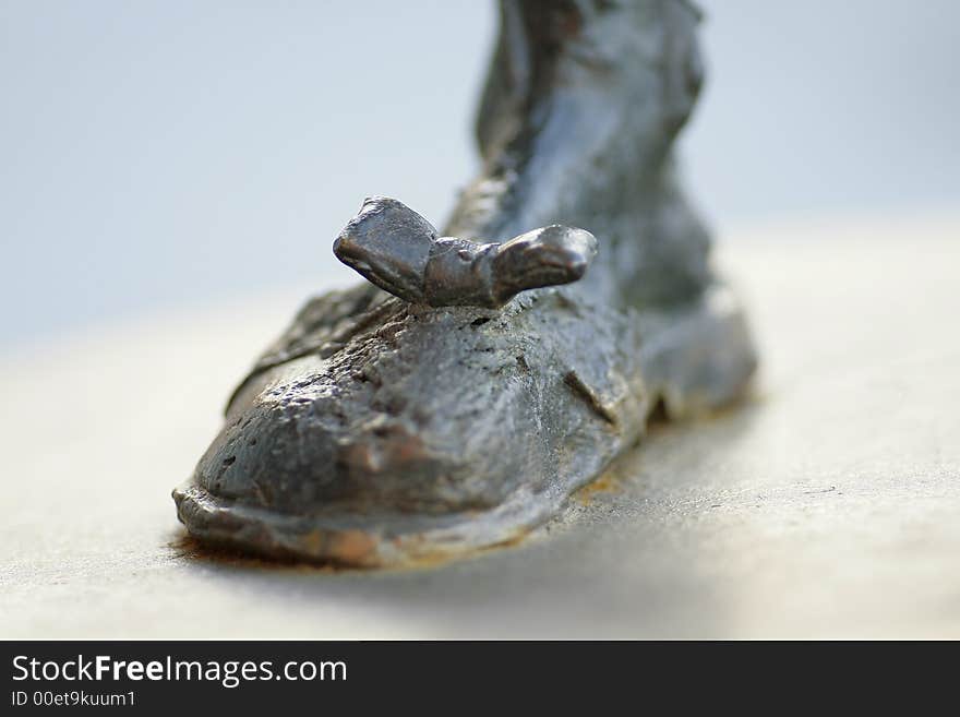 Photo of a Statues Brass Boot.