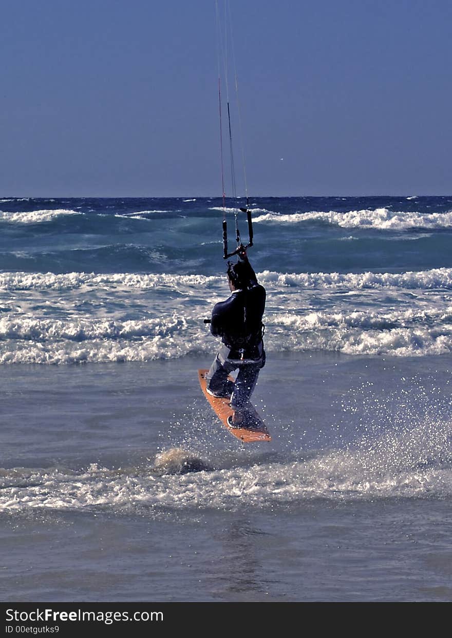 Kite surfer making a jump