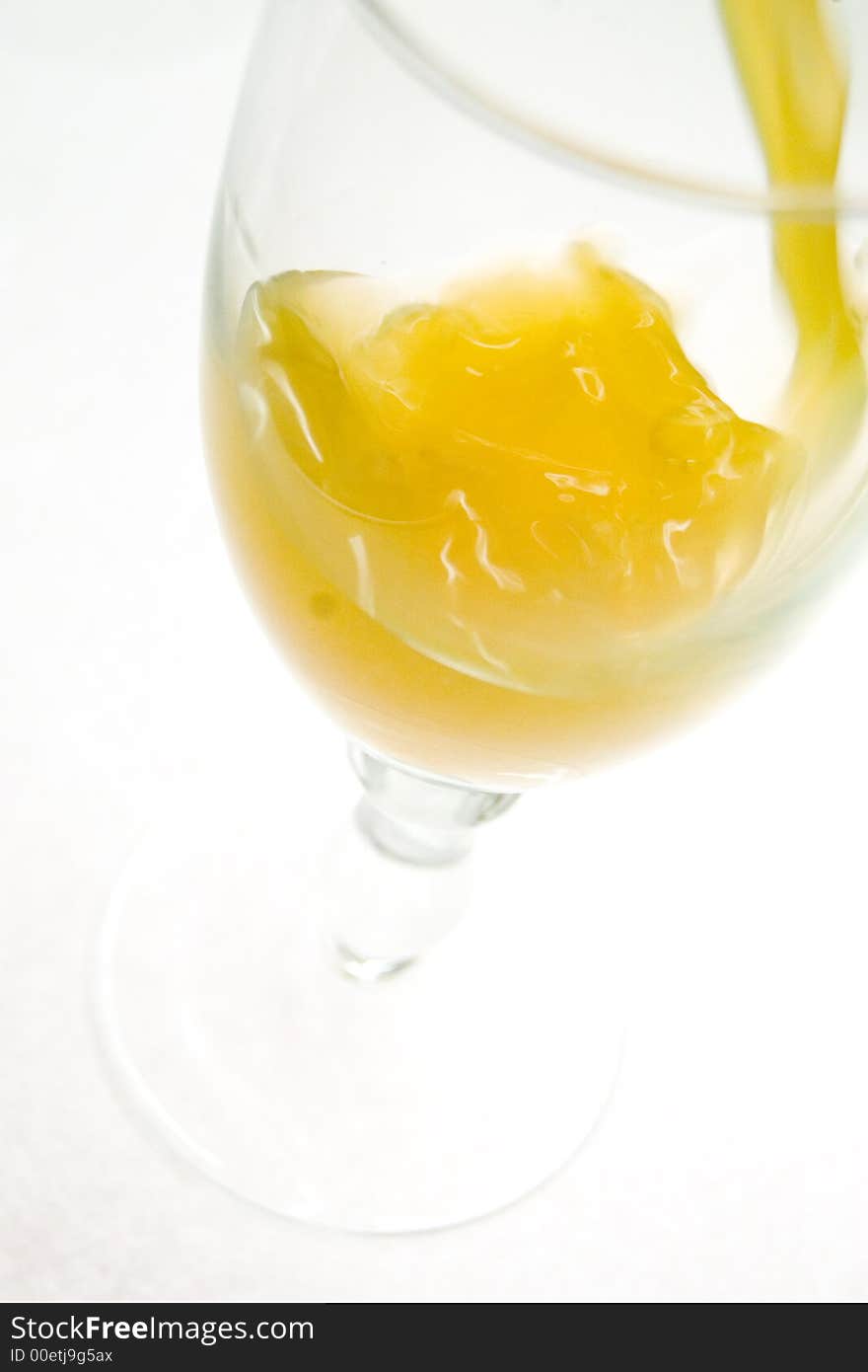 Wineglass with orange juice, liquid, closeup. Wineglass with orange juice, liquid, closeup