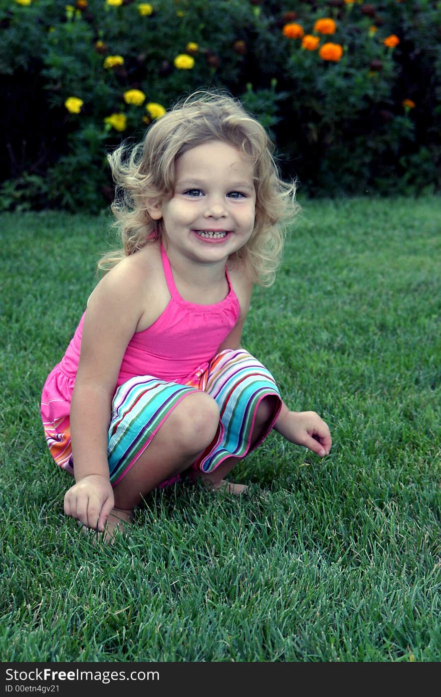 The playful eyes of this child engages the viewer. She exudes the joy and energy of childhood. The playful eyes of this child engages the viewer. She exudes the joy and energy of childhood.