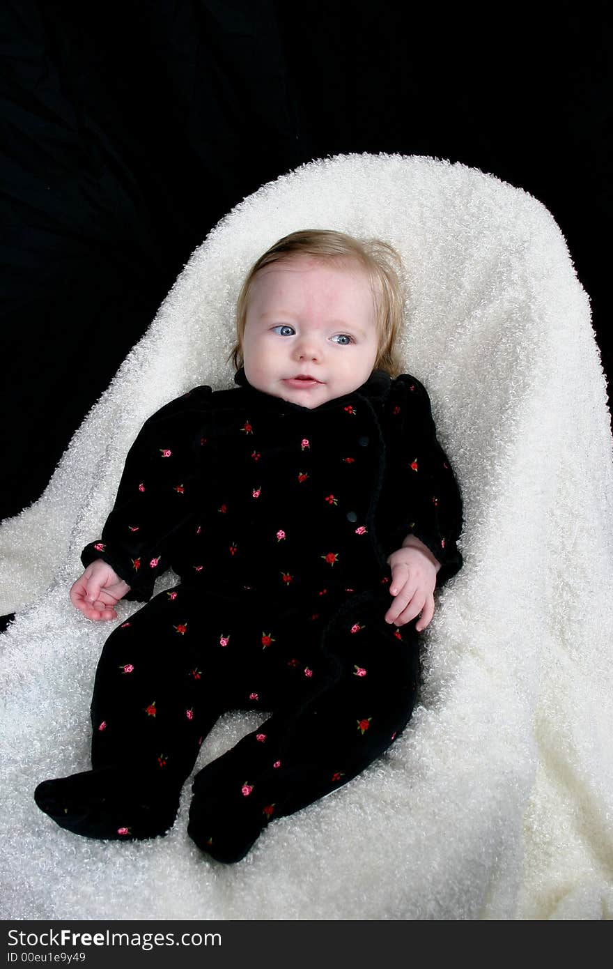 Cute little girl on black background