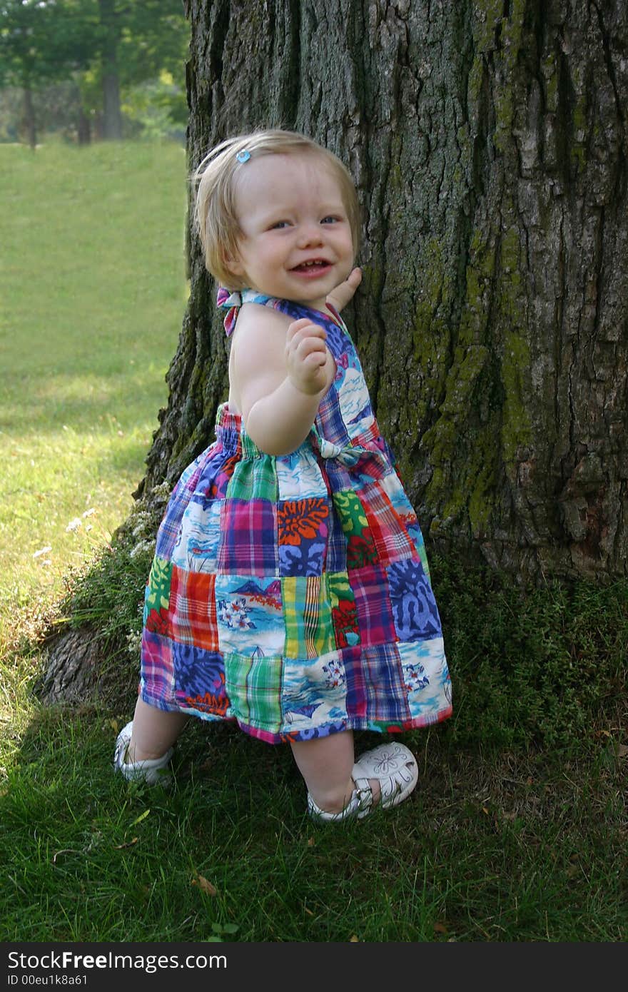 Cute little girl outside in grass