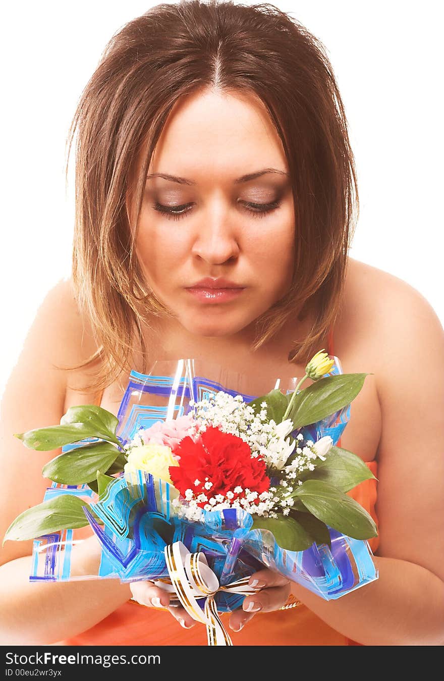 Woman sniffing flowers