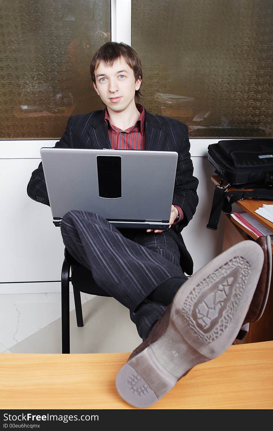 Portrait of a businessman in a working process. Portrait of a businessman in a working process