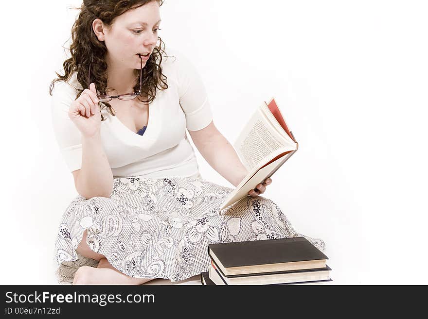 A beautiful young woman studying her books. A beautiful young woman studying her books