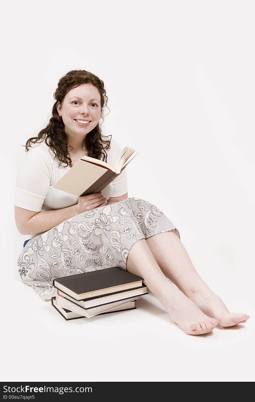 A beautiful young woman studying her books. A beautiful young woman studying her books