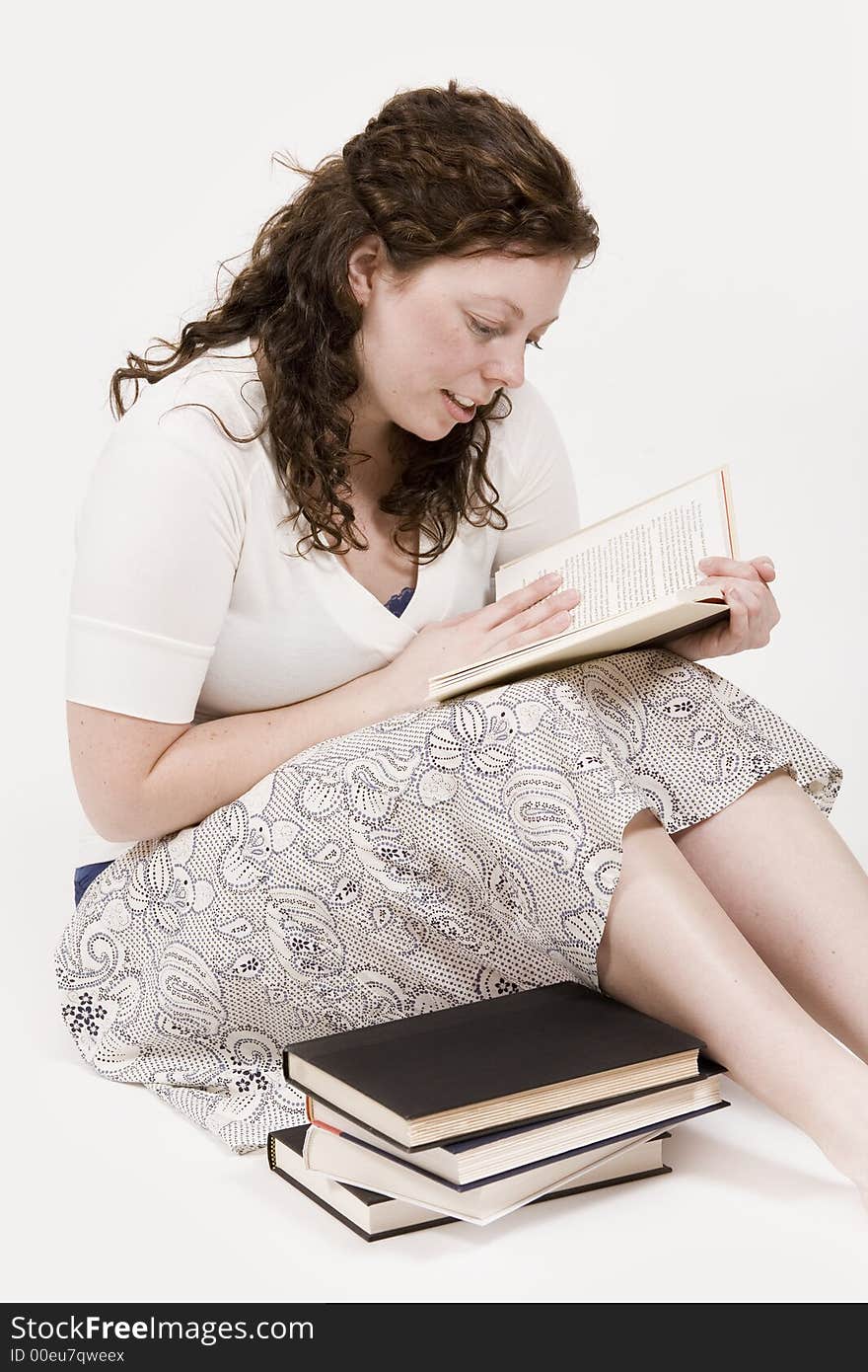 A beautiful young woman studying her books. A beautiful young woman studying her books