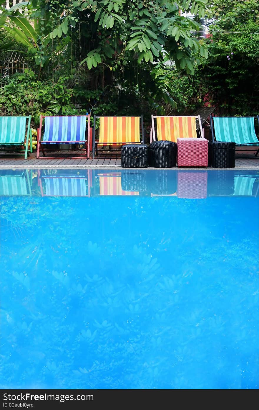 Deck Chairs Next To A Pool