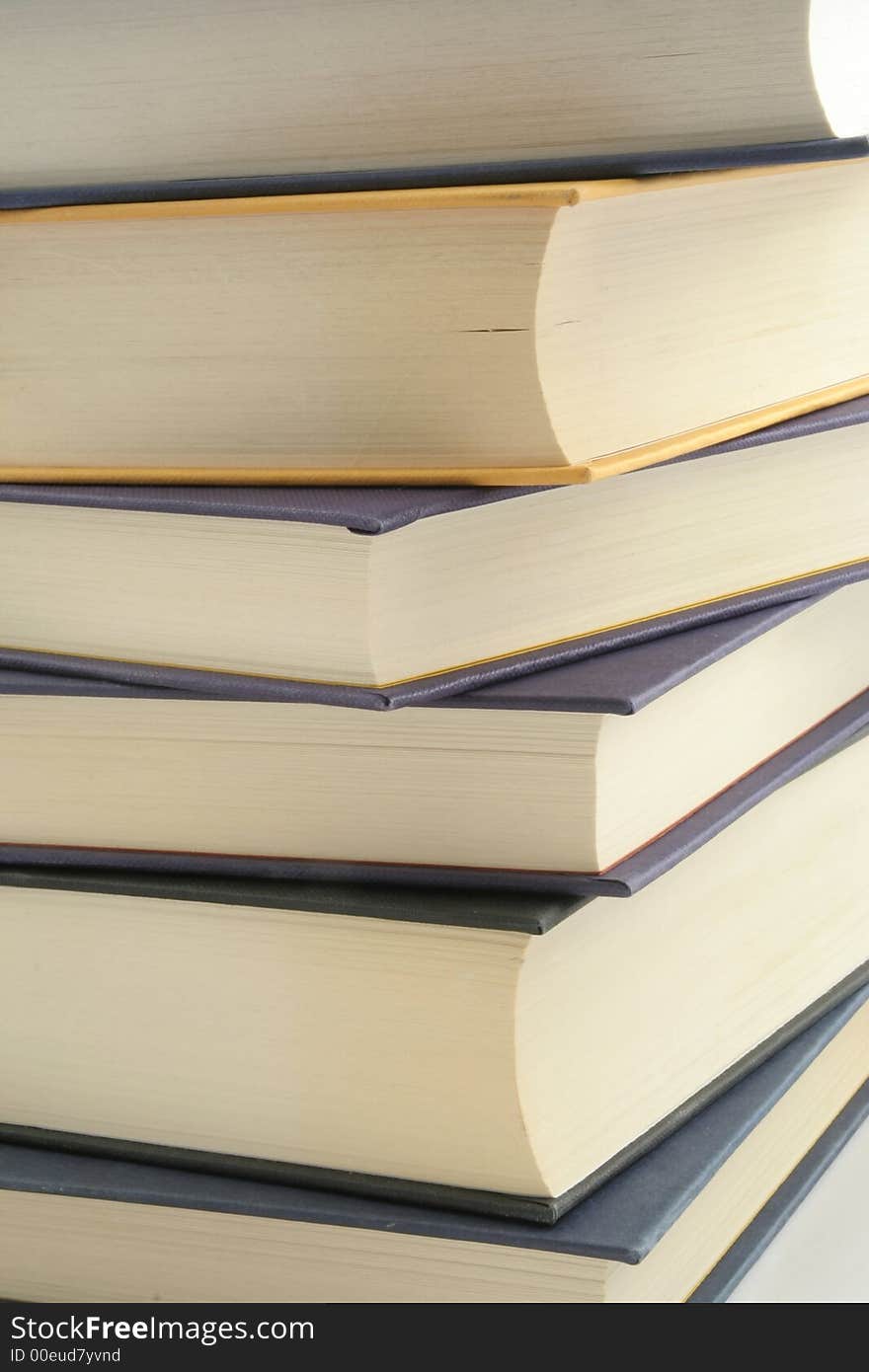 Stack of books against a white background