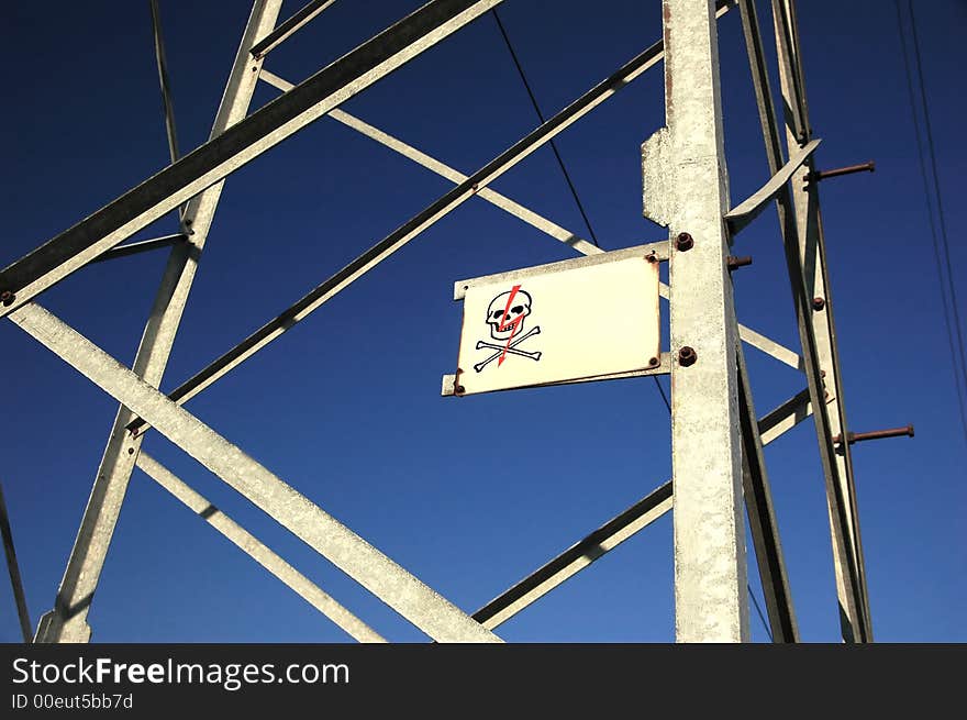 Pillar with skull on the deep blue sky