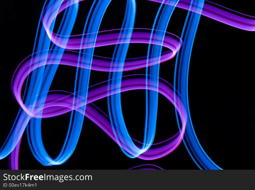 Some colrful LED lights in motion resembling ribbons. Some colrful LED lights in motion resembling ribbons