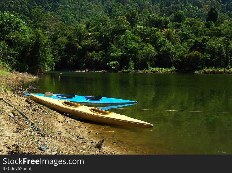 Two vivid canoe at beautiful lake side. Two vivid canoe at beautiful lake side