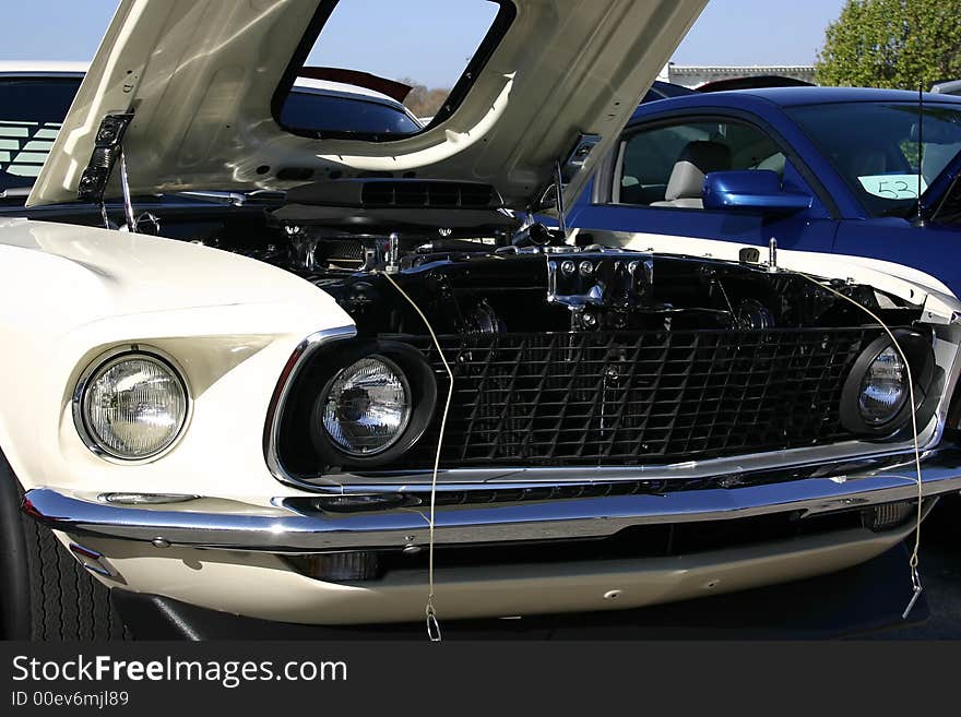 1969 white Ford Mustang front end, shaker hood scoop, 428 Cobra Jet engine. 1969 white Ford Mustang front end, shaker hood scoop, 428 Cobra Jet engine.