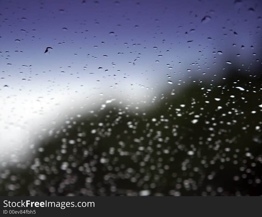 Rain on window with landscape. Rain on window with landscape