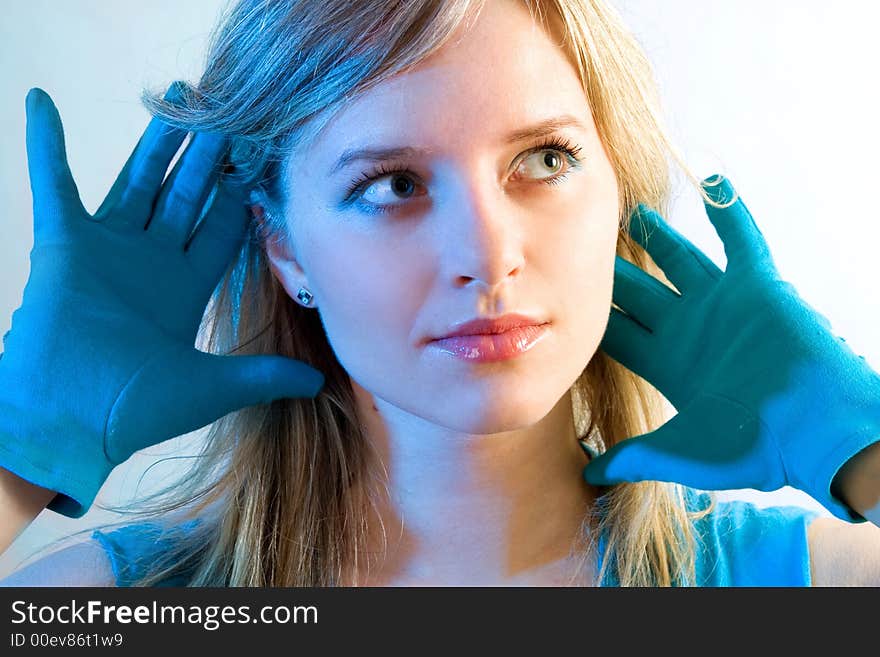 Beautiful woman in blue look at right, special light