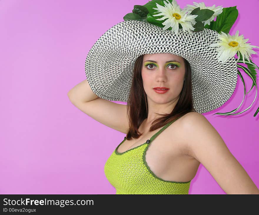 Beauty smiling girl with flowers in her hat. Beauty smiling girl with flowers in her hat