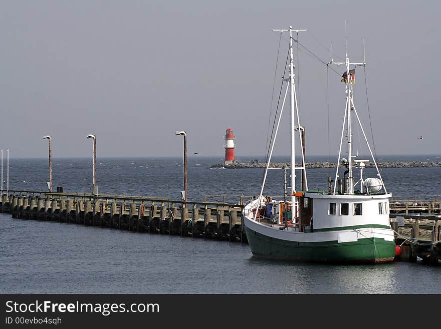 Fisherboat in harbour on sea