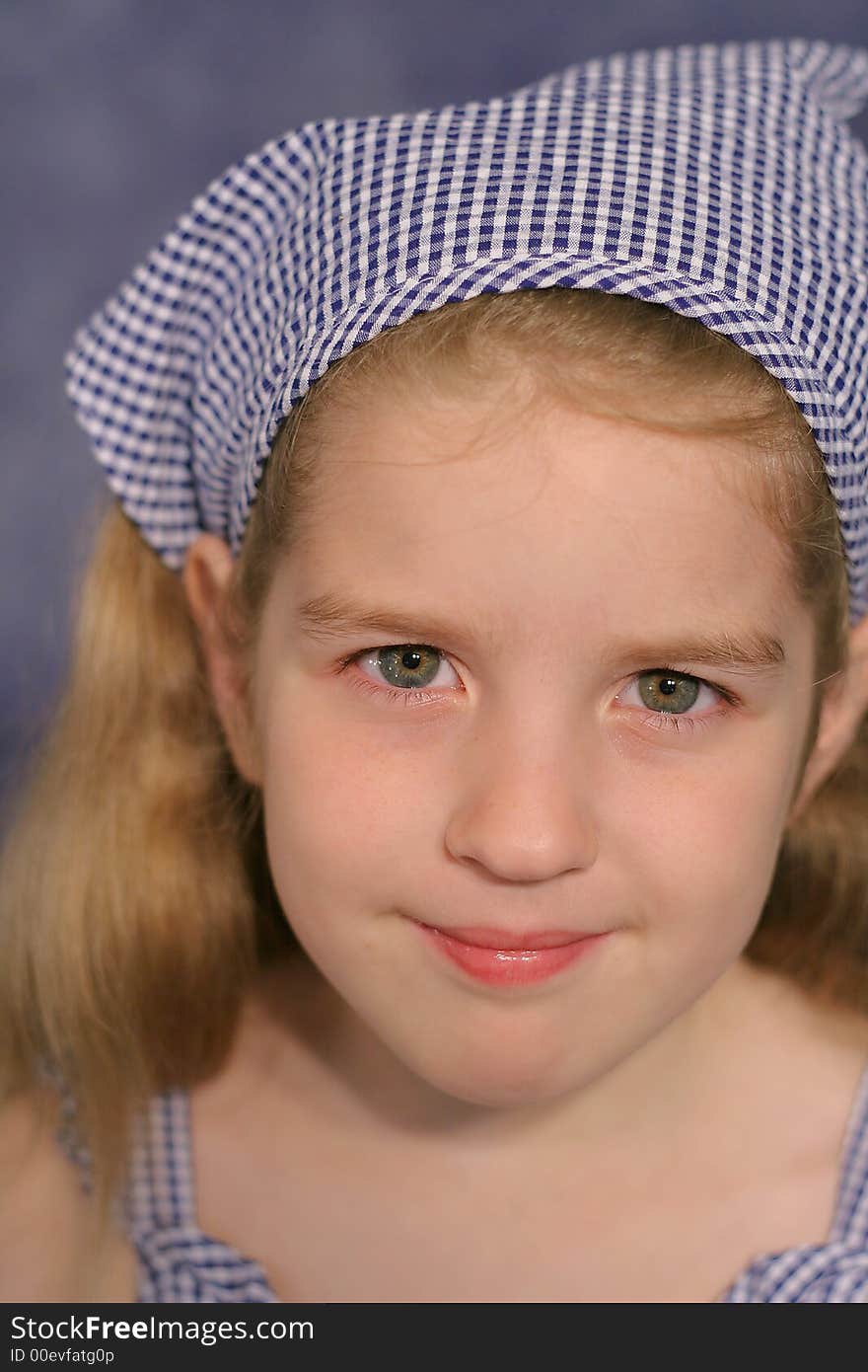 Shot of a cute little girl portrait on blue vertical