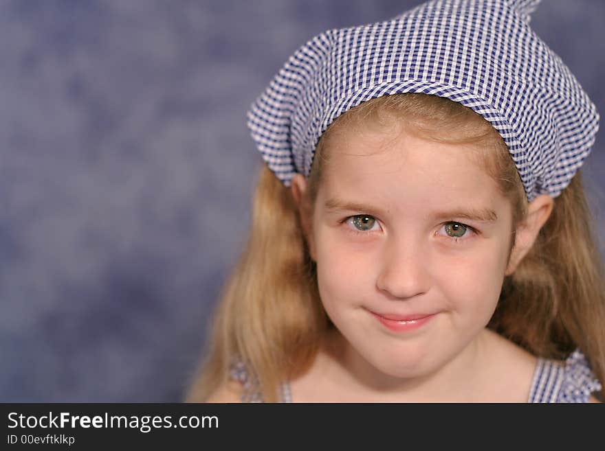 Shot of a cute little girl portrait on blue