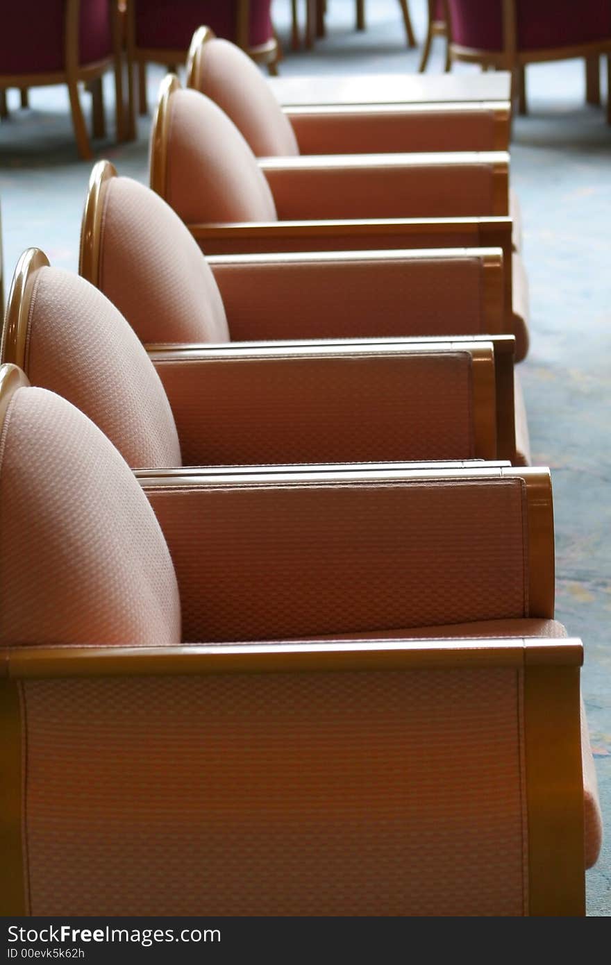 Row of cushion chairs in hotel lobby. Row of cushion chairs in hotel lobby