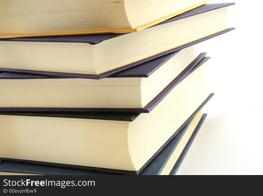 Stack of books against a white background