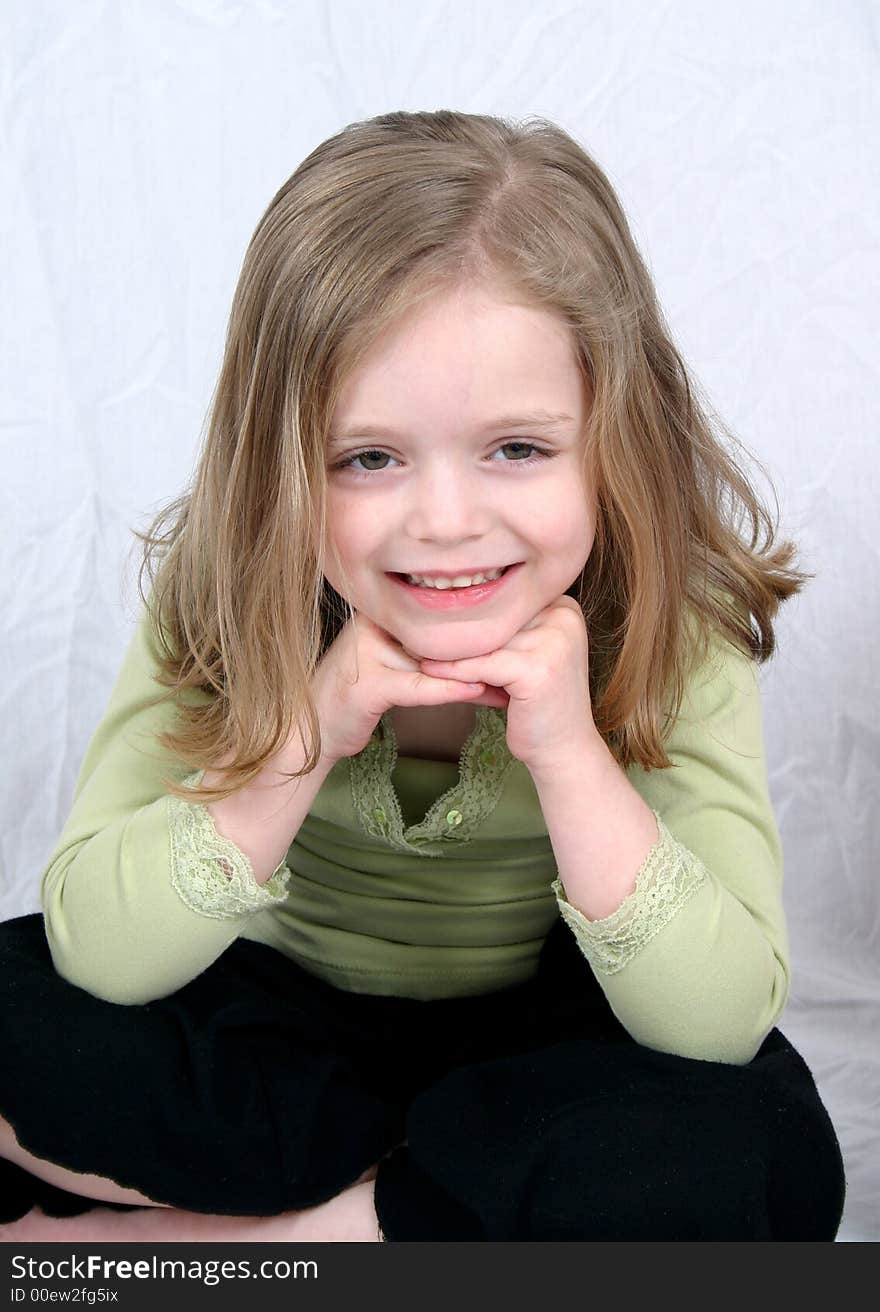 Little girl smiling on white background