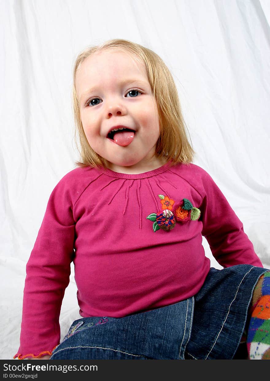 Cute little girl on a white background