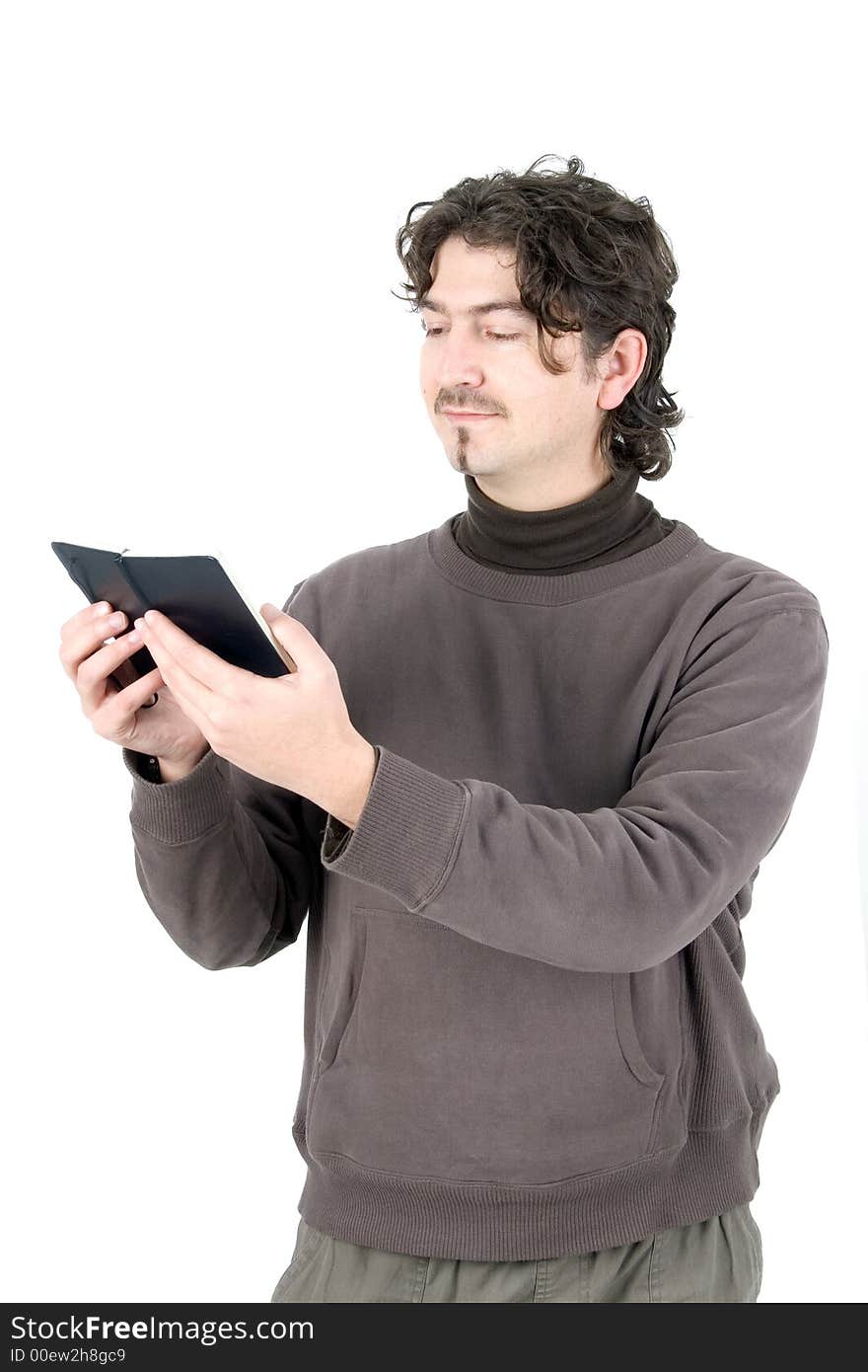 Young man reading a book over white background