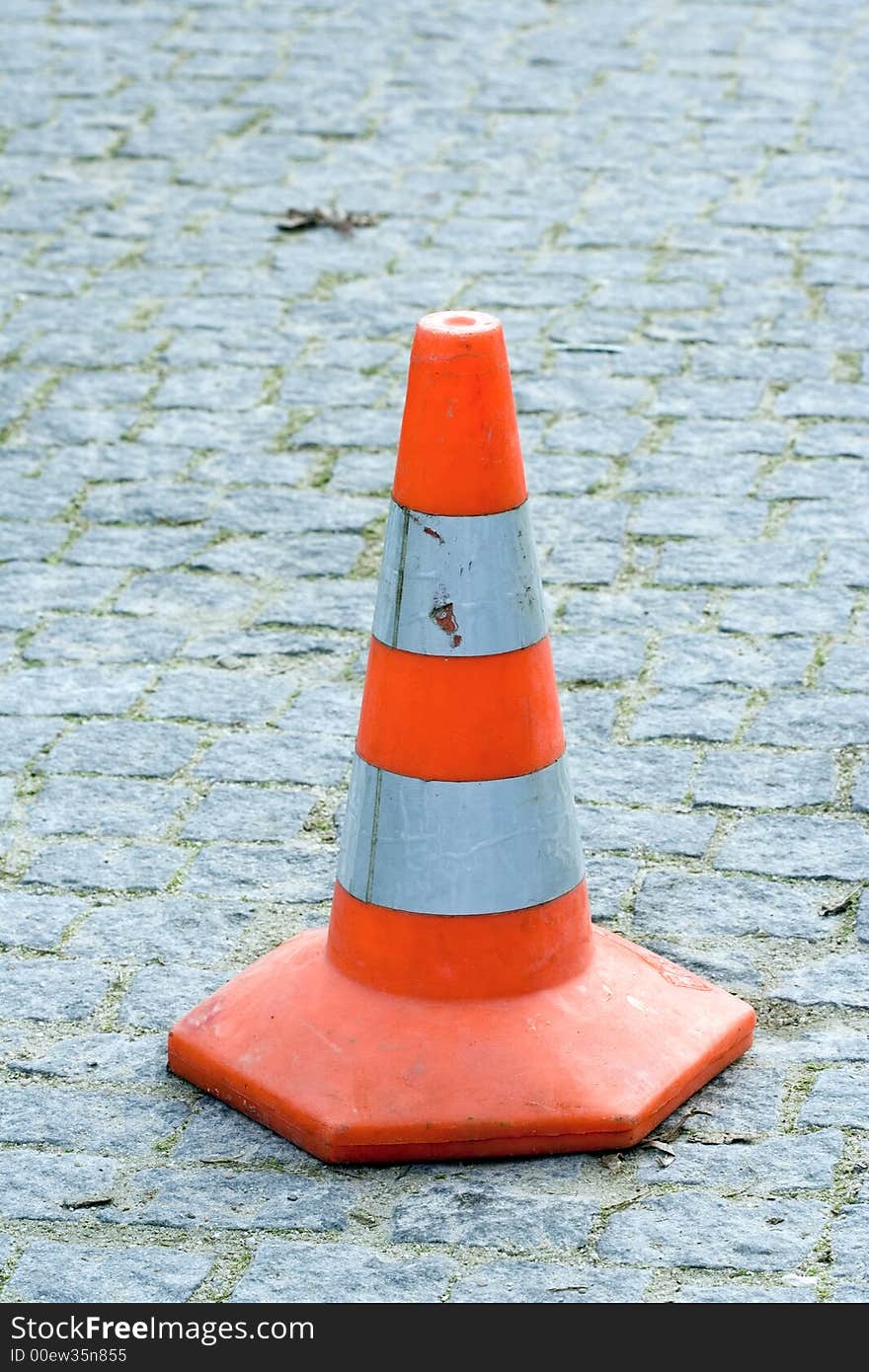 Orange traffic cone on the road