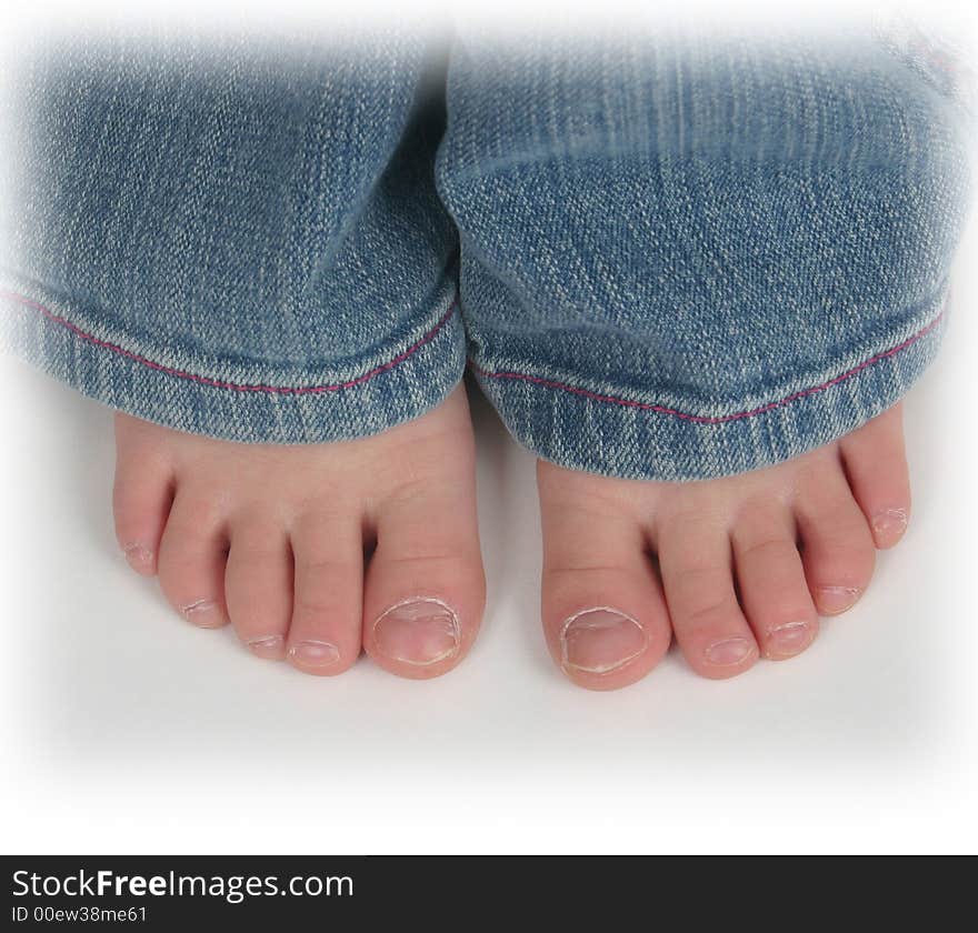 Close up of child's toes on a white background