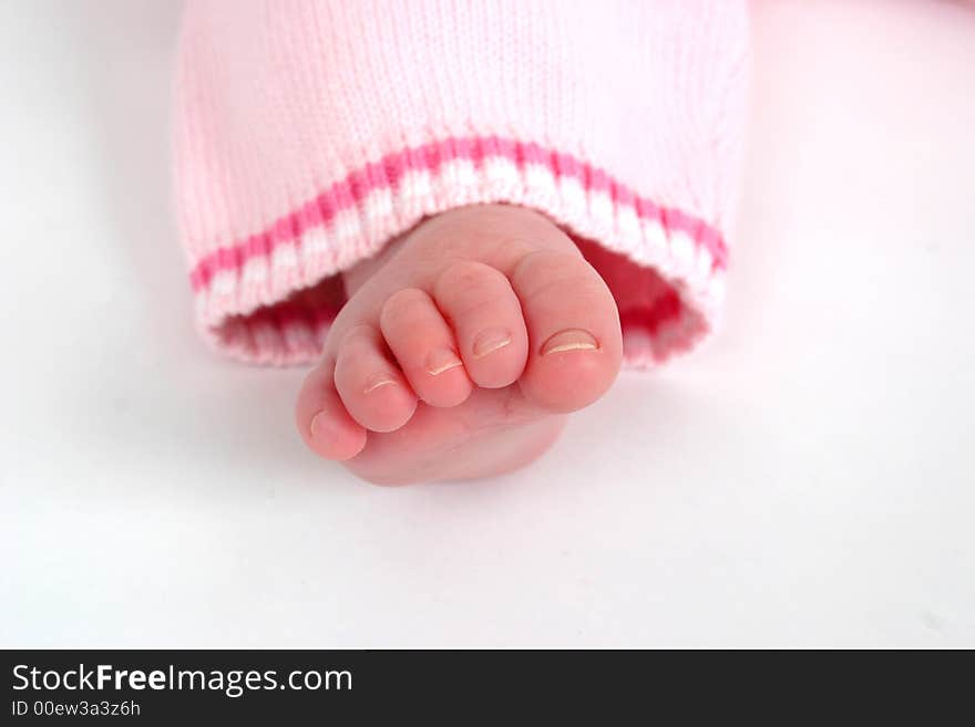 Close up of child's toes on a white background