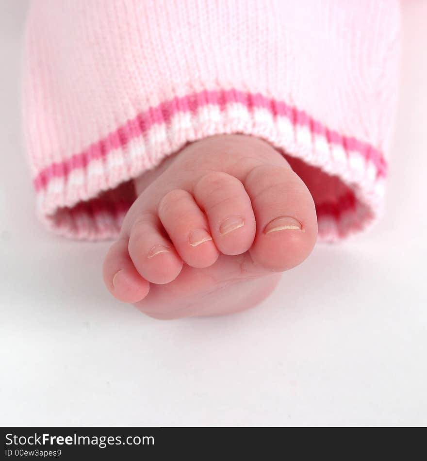 Close up of child's toes on a white background