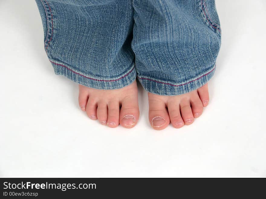 Close up of child's toes on a white background