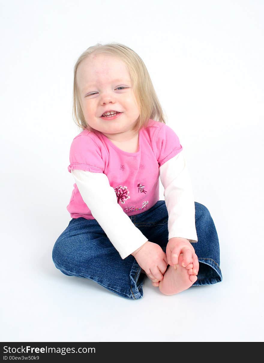 Cute little girl on white