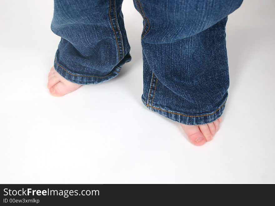 Close up of child's toes on white background