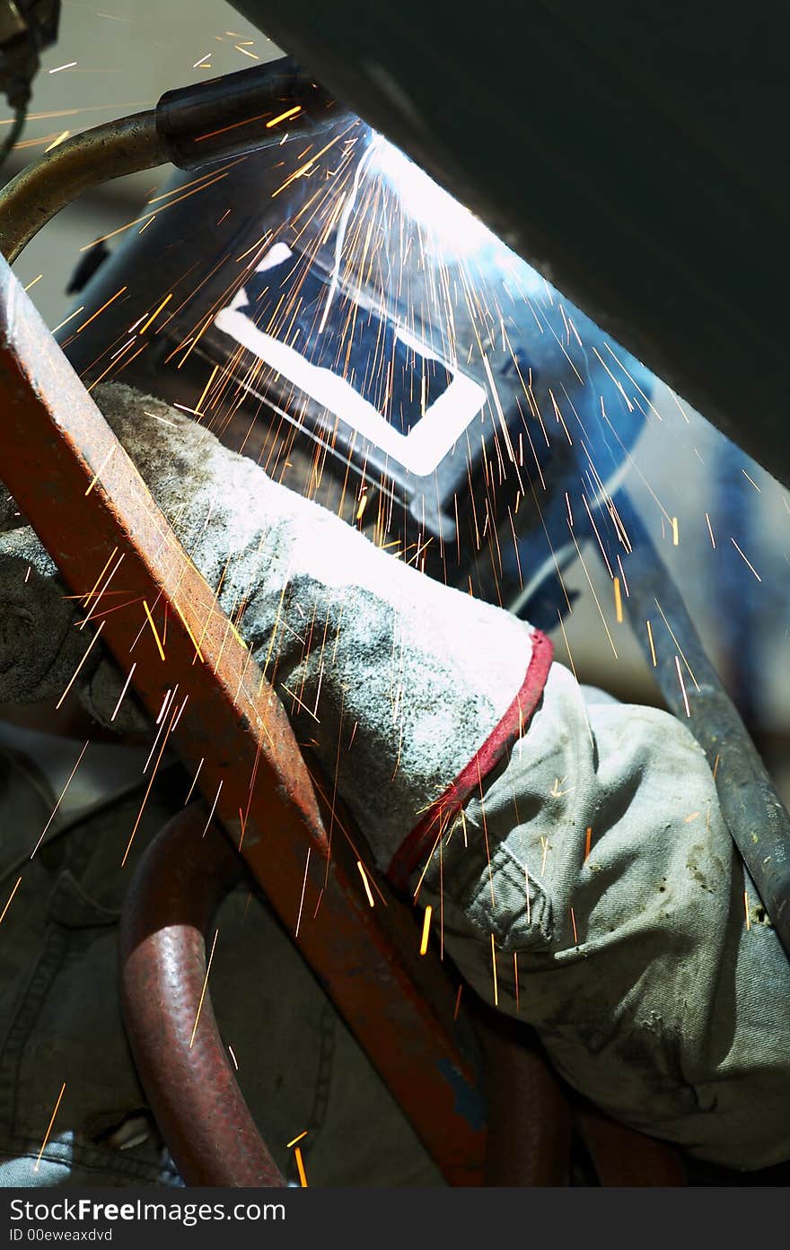 One welder working on steel project. One welder working on steel project