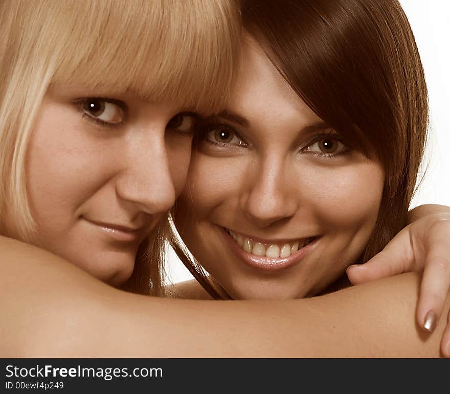 Happy young women friends talking and laughing. Happy young women friends talking and laughing.