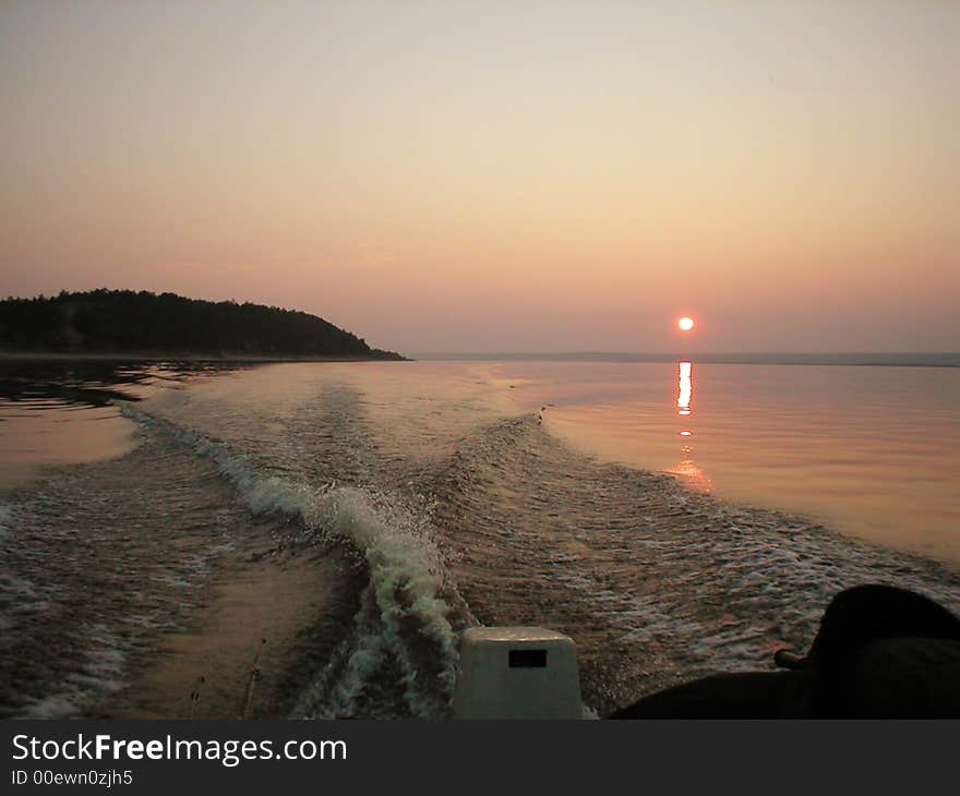 Scene of the sundown sun on фое yard from boat. Scene of the sundown sun on фое yard from boat