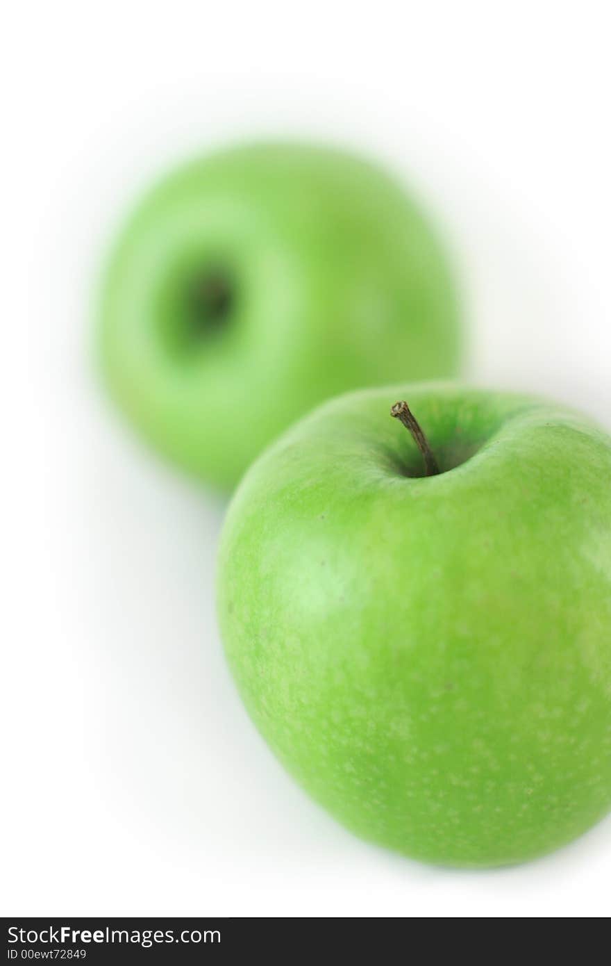 Couple of fresh green apples on white background