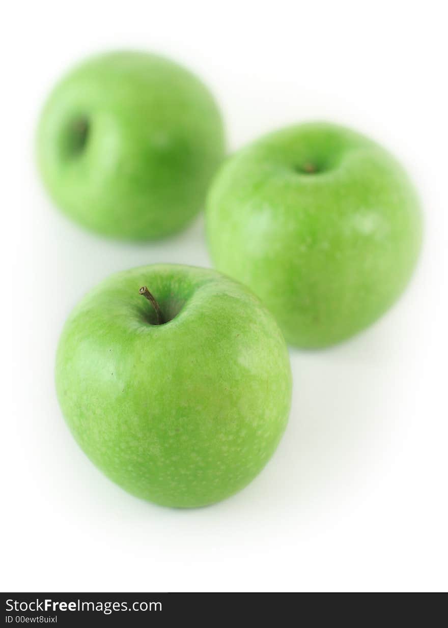 Some fresh green apples on white background