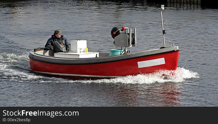 Fisherman in a motor boat