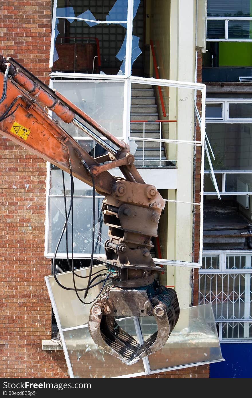 Demolition of a large window on a stairwell. Demolition of a large window on a stairwell