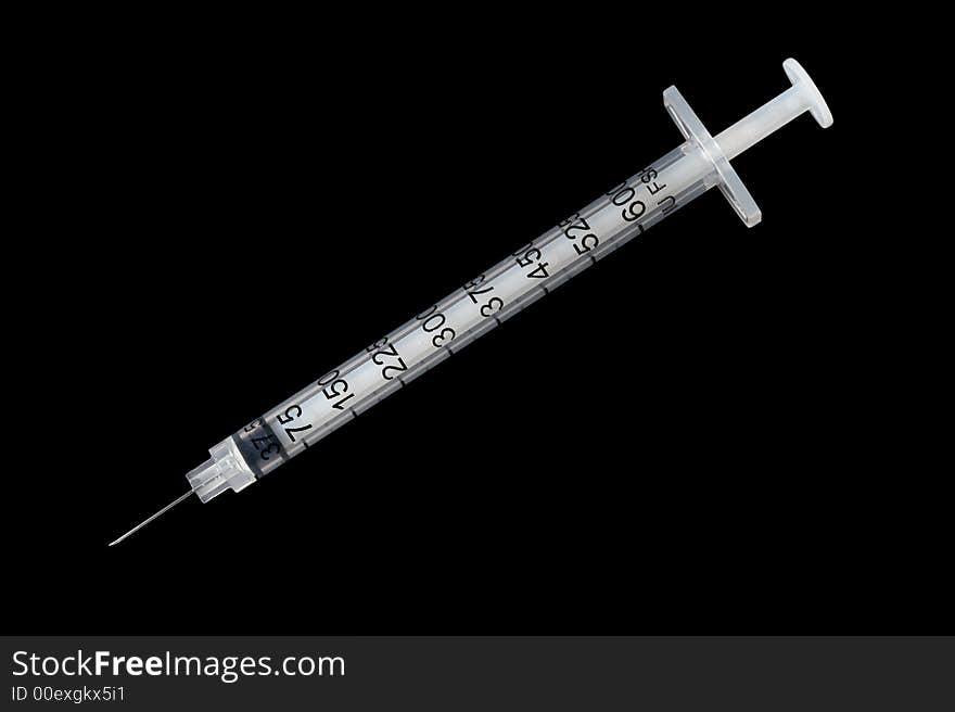 Hypodermic syringe with finer gauge needle for less pain, isolated on black background. Hypodermic syringe with finer gauge needle for less pain, isolated on black background